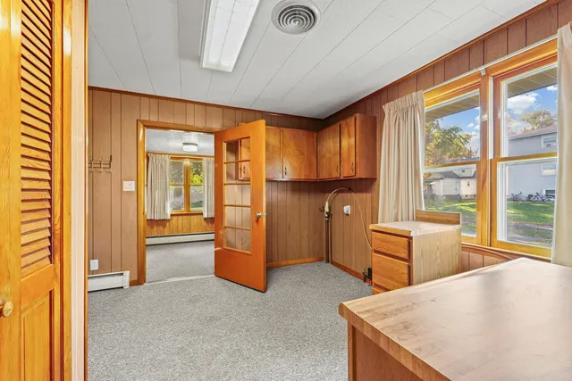 a view of kitchen with furniture and large window