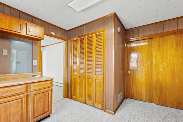 a view of a kitchen with wooden floor and a sink