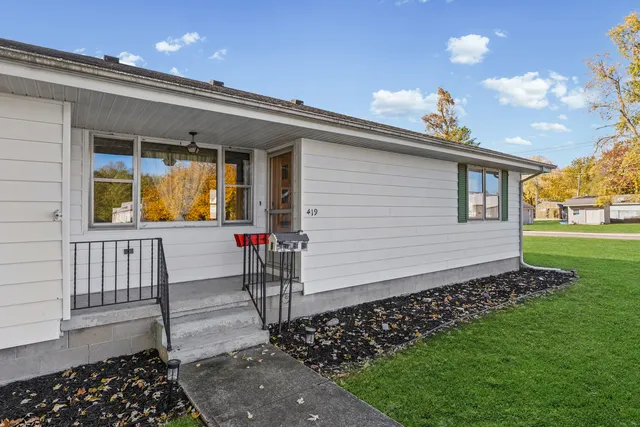a front view of a house with a yard