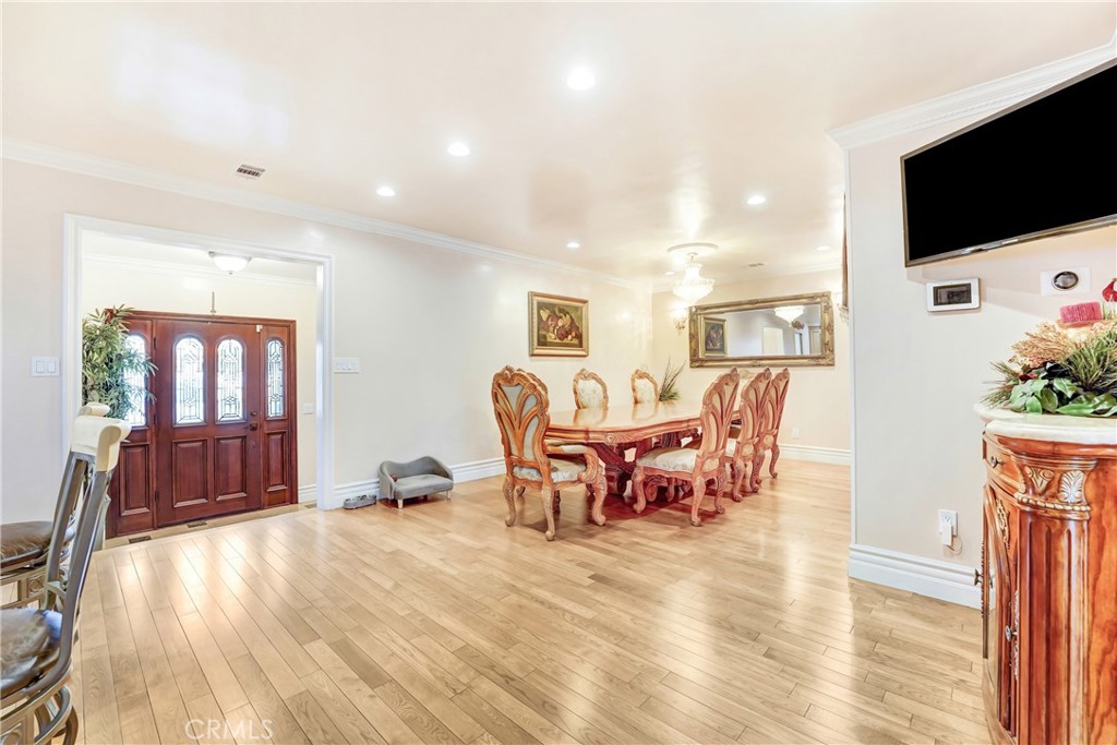 19530 Enadia Way Reseda, CA 91335 - Photo 3 of 16 a view of a livingroom with furniture window and wooden floor