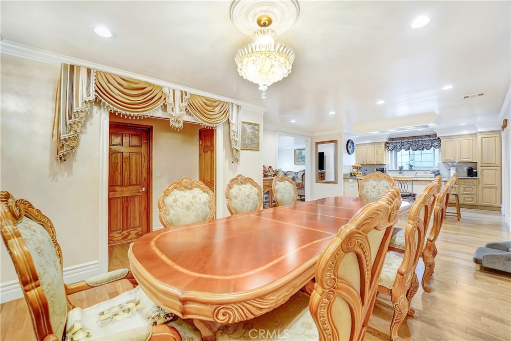 19530 Enadia Way Reseda, CA 91335 - Photo 4 of 16 a dining room with furniture and wooden floor