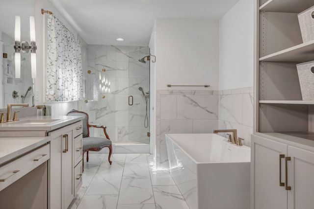 a living room with furniture large window and wooden floor