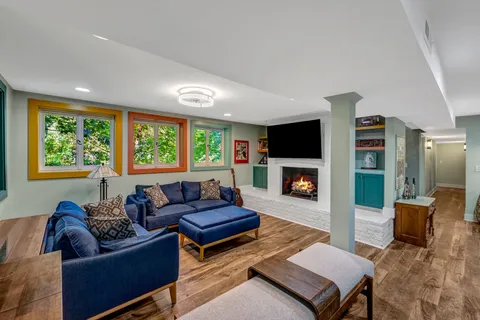 a view of a workspace with furniture and a workspace