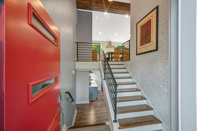 a view of a hallway with staircase