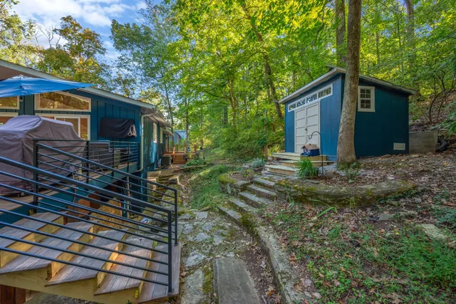 a view of a deck with couches under an umbrella