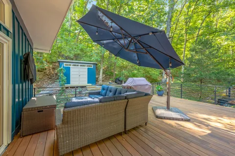 a view of balcony and yard