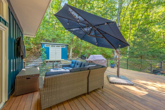 a view of balcony and yard