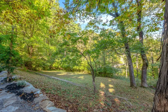 a view of a bench in front of house