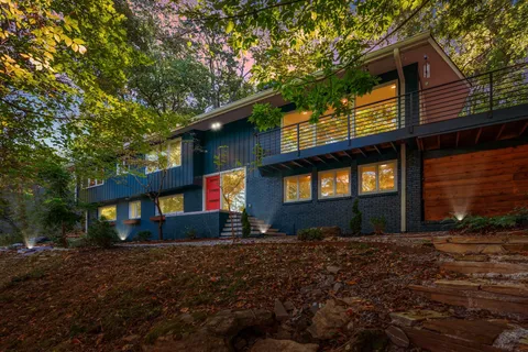a view of wooden door and a window