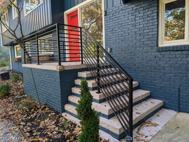a view of a brick house with large windows