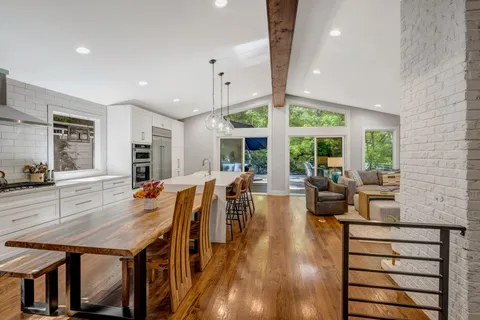 a view of a dining room with furniture window and wooden floor