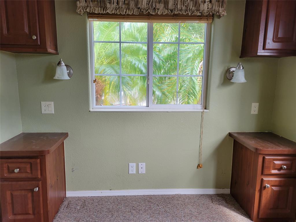 3759 Southwest 6th Avenue Okeechobee, FL 34974 - Photo 15 of 27 a view of a room that has a window and a washer dryer