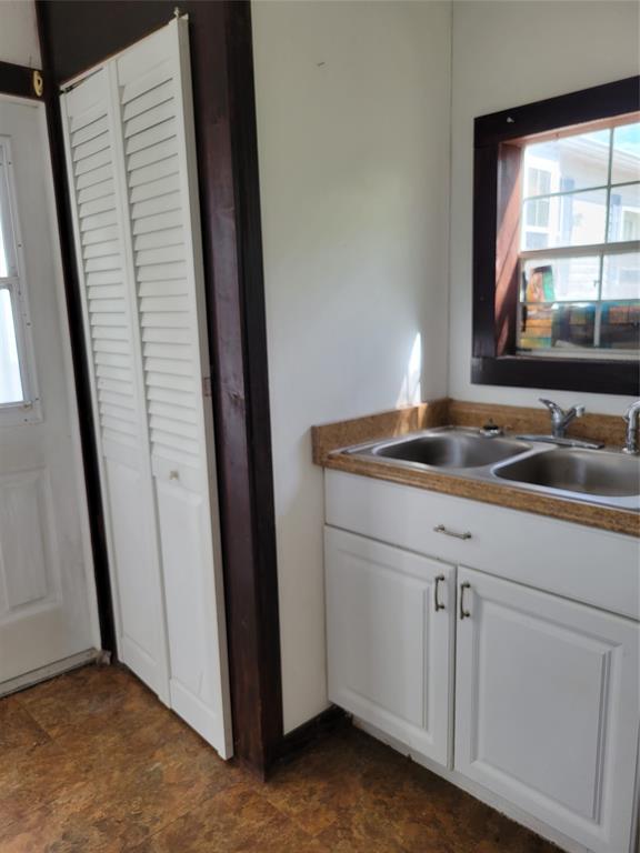 3759 Southwest 6th Avenue Okeechobee, FL 34974 - Photo 25 of 27 a bathroom with a sink and a mirror
