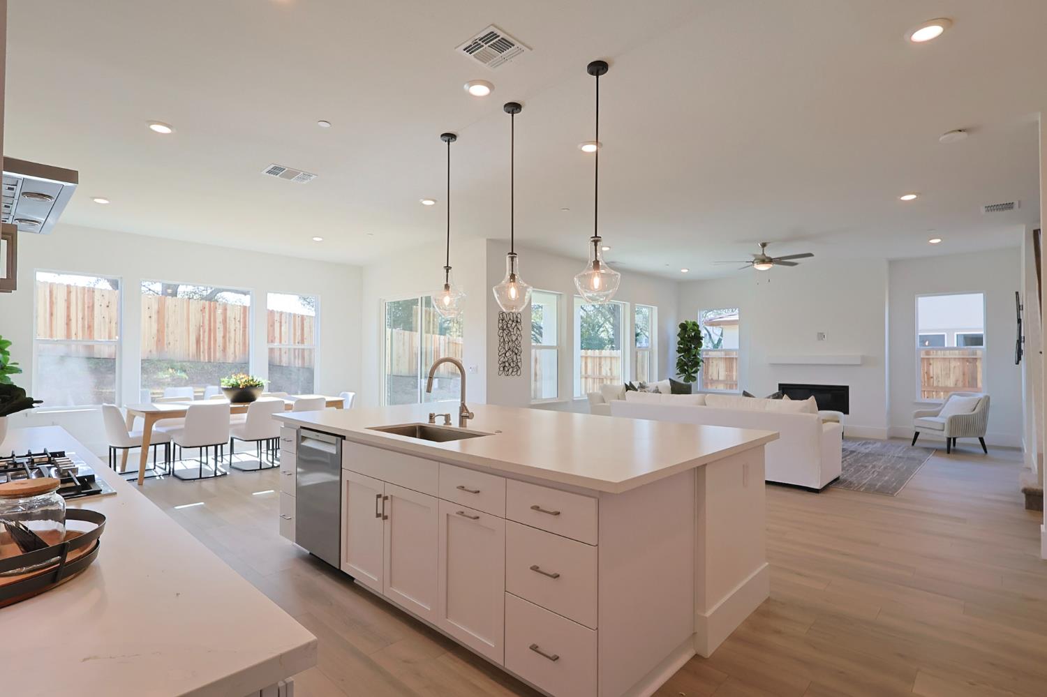 5638 Lakepointe Drive Rocklin, CA 95677 - Photo 4 of 30 a large white kitchen with a large window and stainless steel appliances