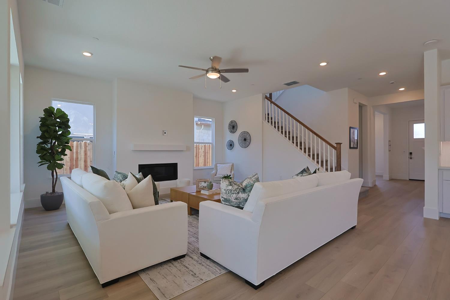 5638 Lakepointe Drive Rocklin, CA 95677 - Photo 7 of 30 a living room with furniture and a fireplace