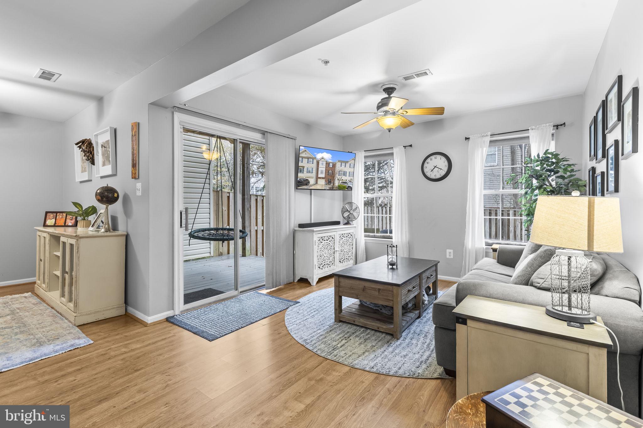 204 Braxton Way, Unit 204 Edgewater, MD 21037 - Photo 11 of 50 a living room with furniture and wooden floor
