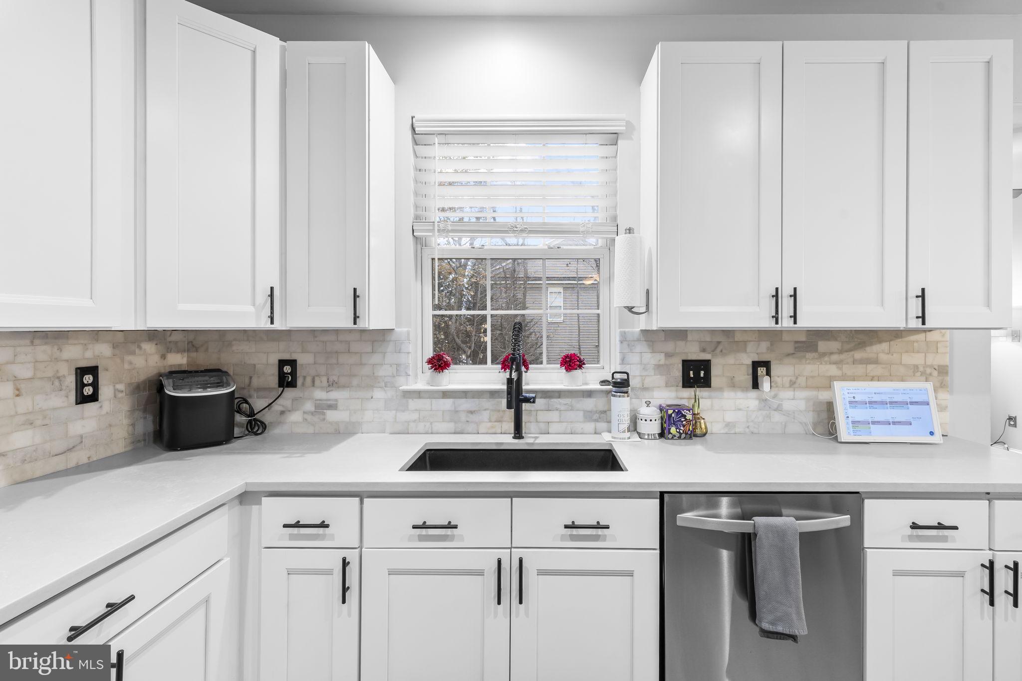 204 Braxton Way, Unit 204 Edgewater, MD 21037 - Photo 20 of 50 a kitchen with stainless steel appliances white cabinets and a window