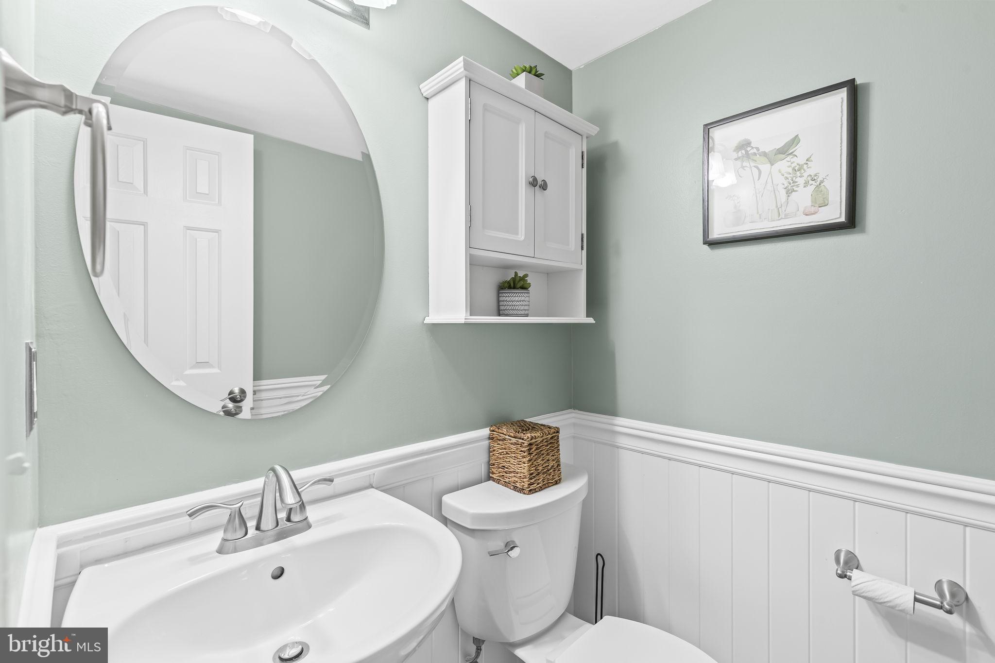 204 Braxton Way, Unit 204 Edgewater, MD 21037 - Photo 25 of 50 a bathroom with a sink mirror and toilet