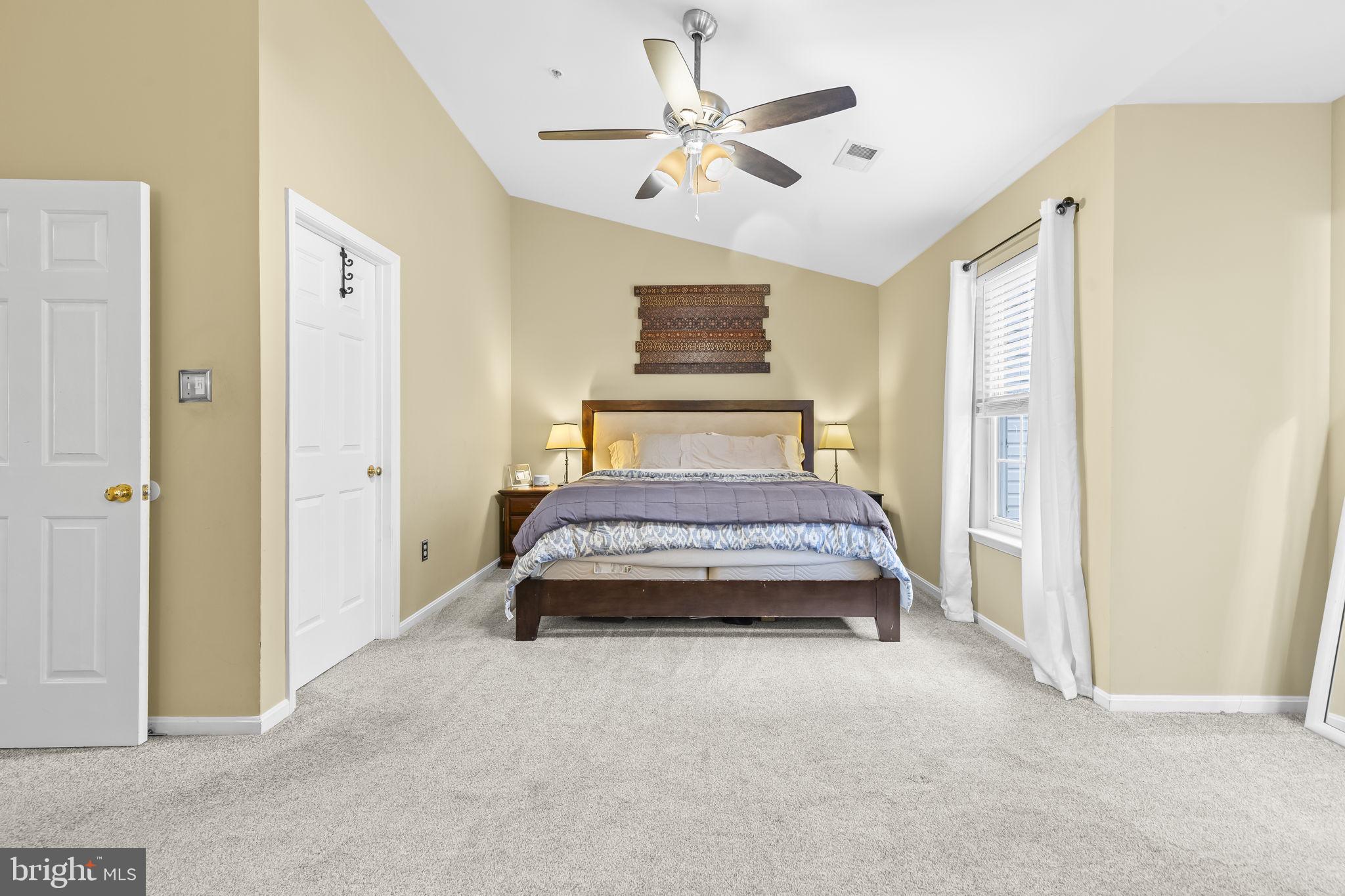 204 Braxton Way, Unit 204 Edgewater, MD 21037 - Photo 28 of 50 a bedroom with a bed and a table