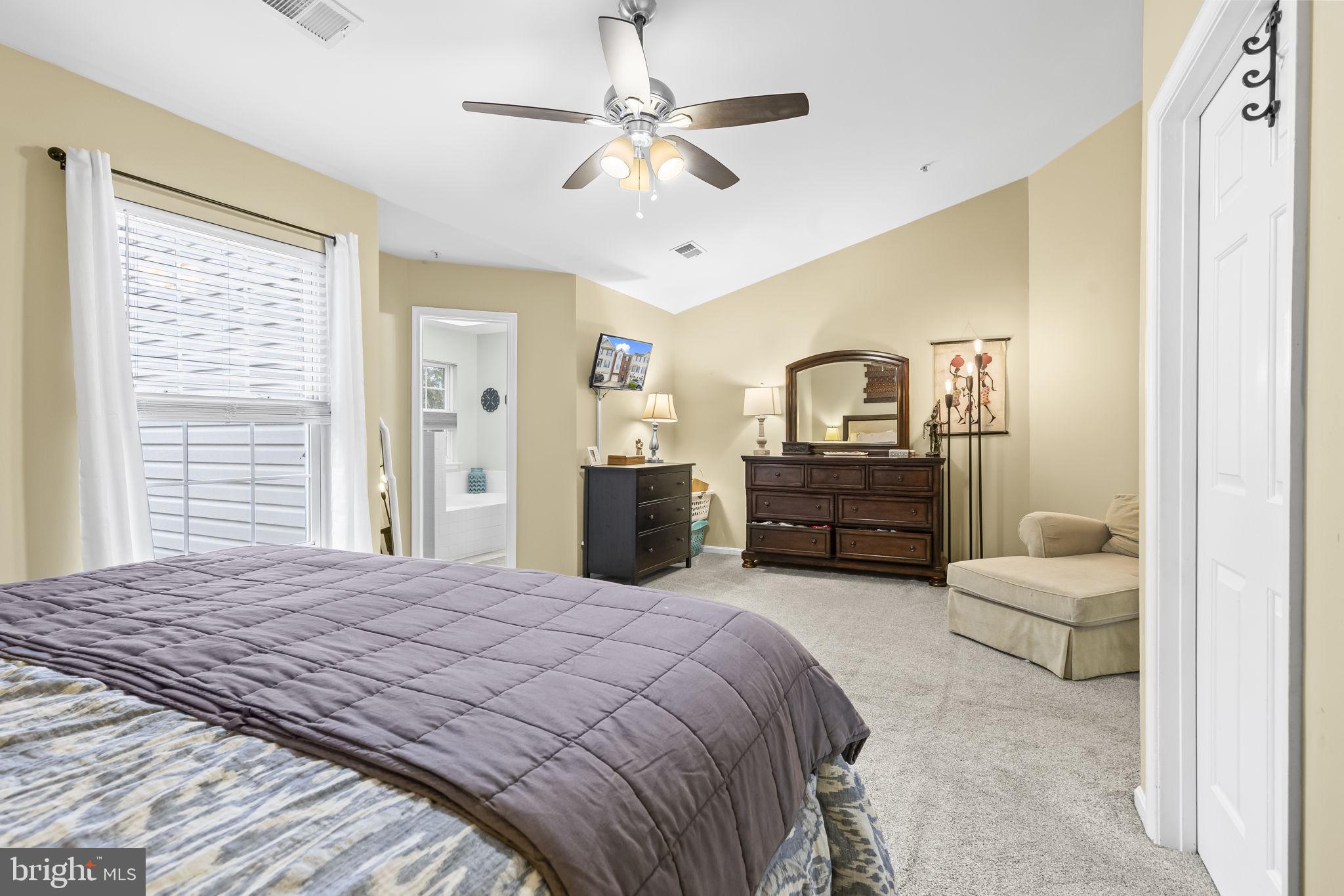 204 Braxton Way, Unit 204 Edgewater, MD 21037 - Photo 30 of 50 a bedroom with a bed and ceiling fan