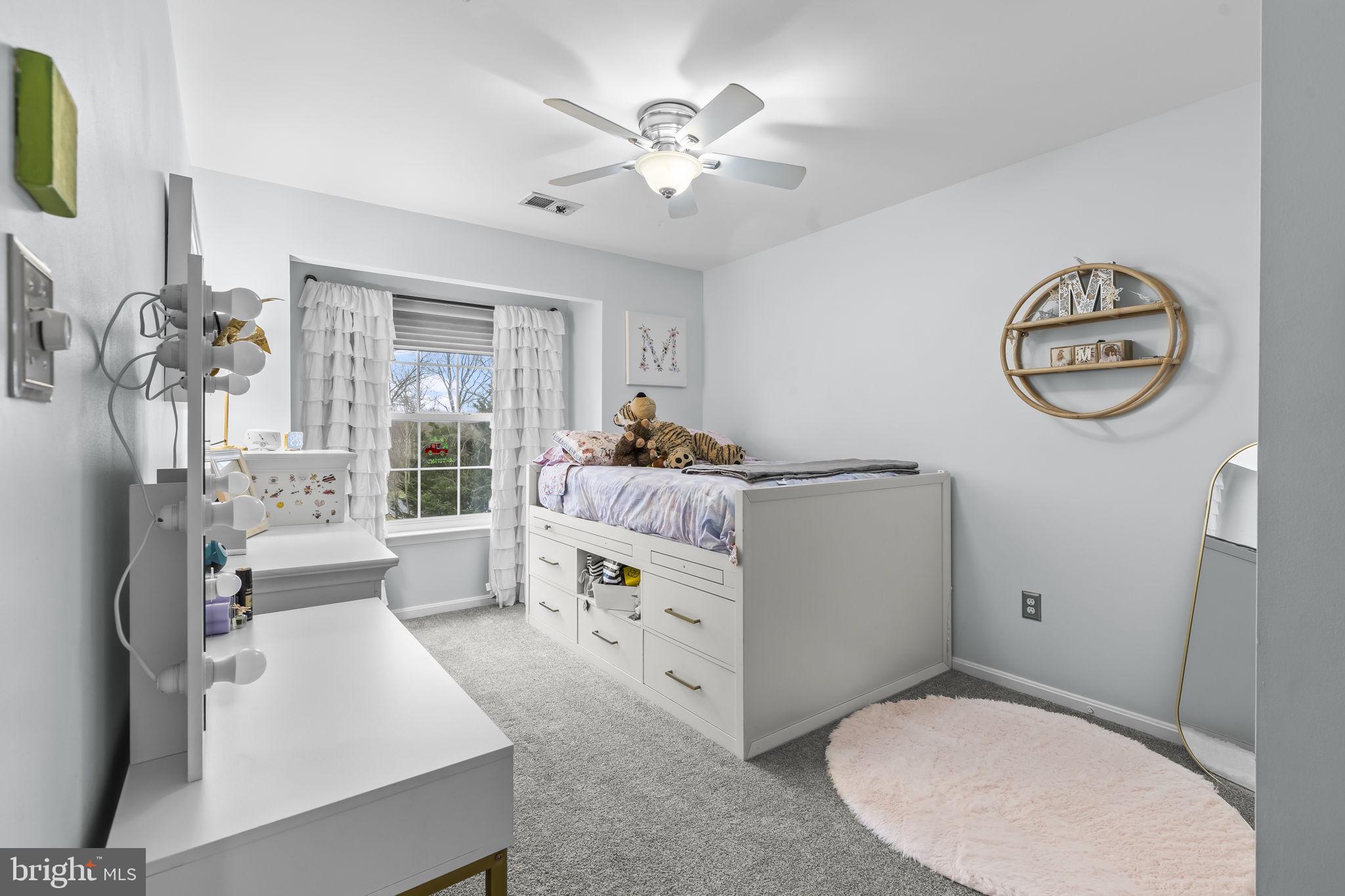204 Braxton Way, Unit 204 Edgewater, MD 21037 - Photo 37 of 50 a living room with furniture and a table