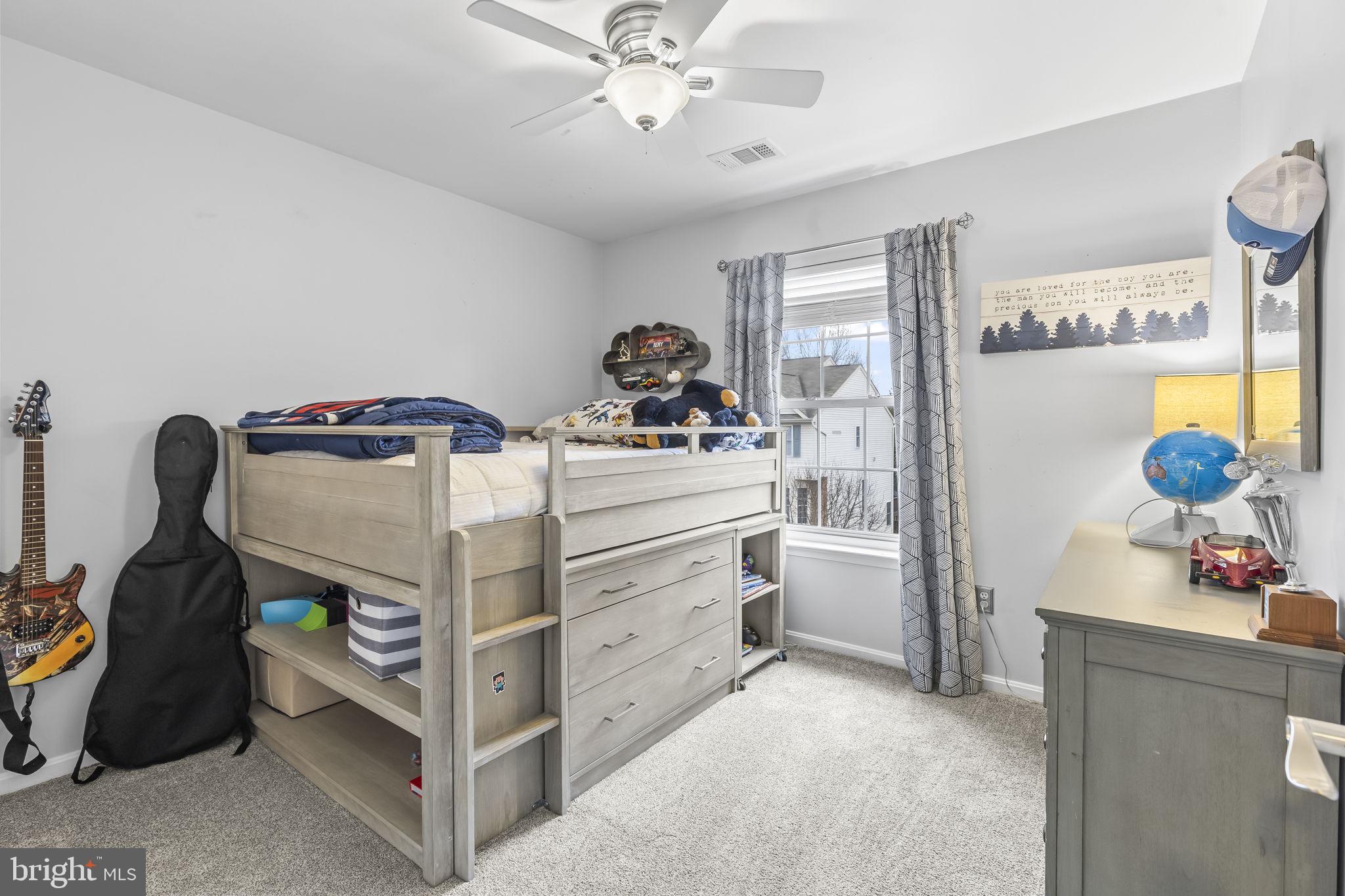 204 Braxton Way, Unit 204 Edgewater, MD 21037 - Photo 39 of 50 a bedroom with a bed and cabinets