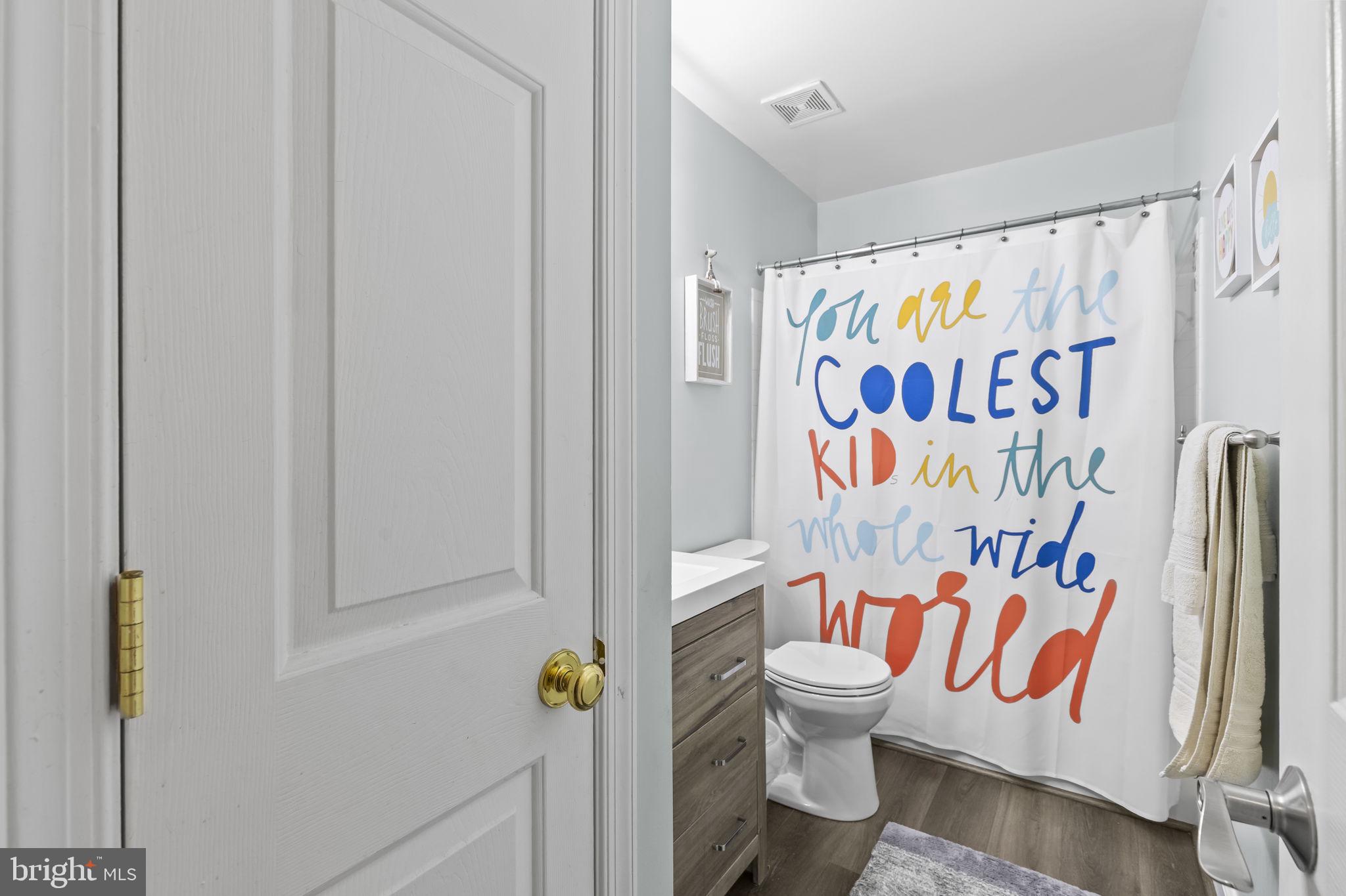 204 Braxton Way, Unit 204 Edgewater, MD 21037 - Photo 42 of 50 a bathroom with a toilet and shower curtain