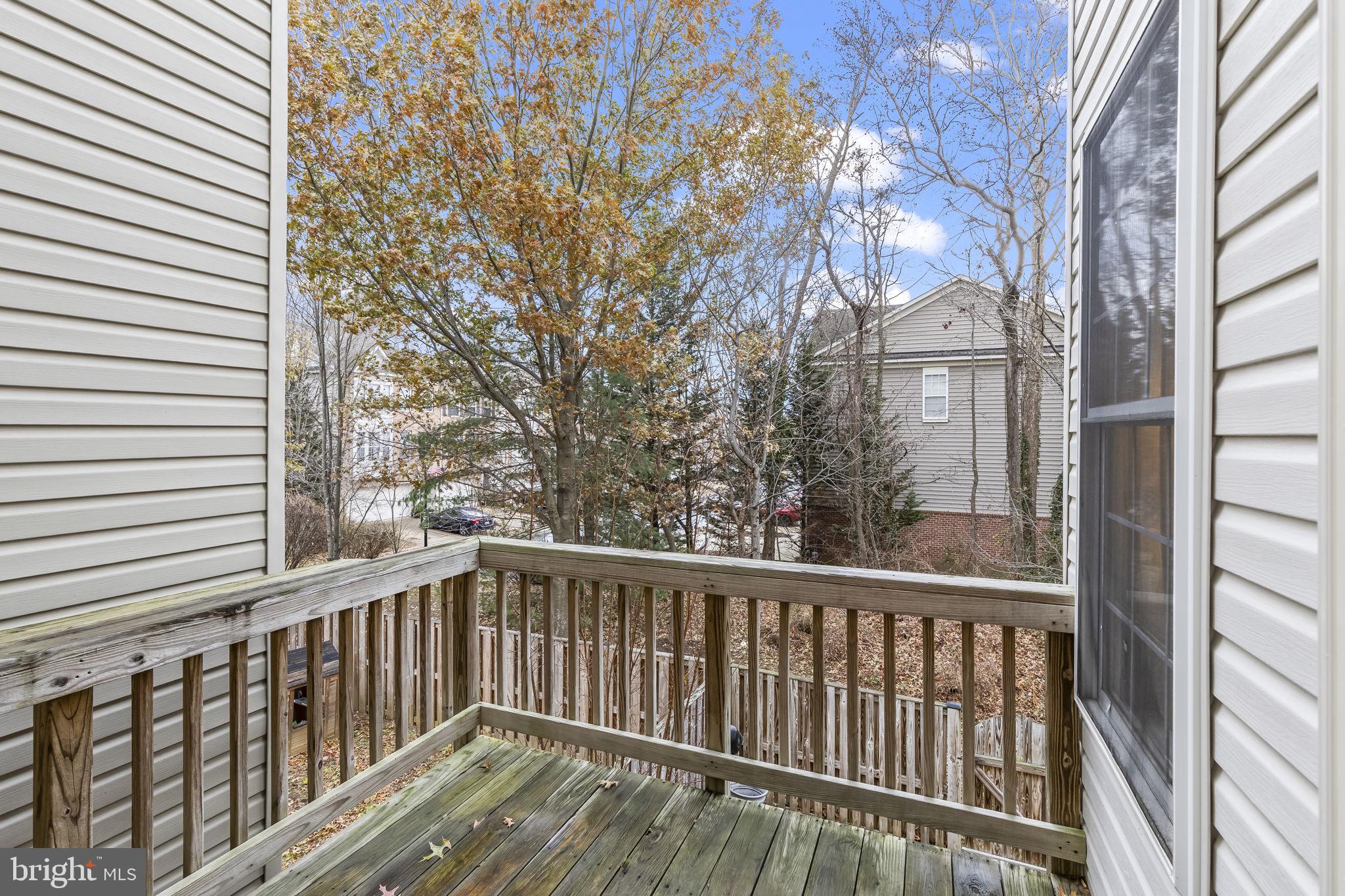 204 Braxton Way, Unit 204 Edgewater, MD 21037 - Photo 44 of 50 a view of balcony with wooden floor and fence