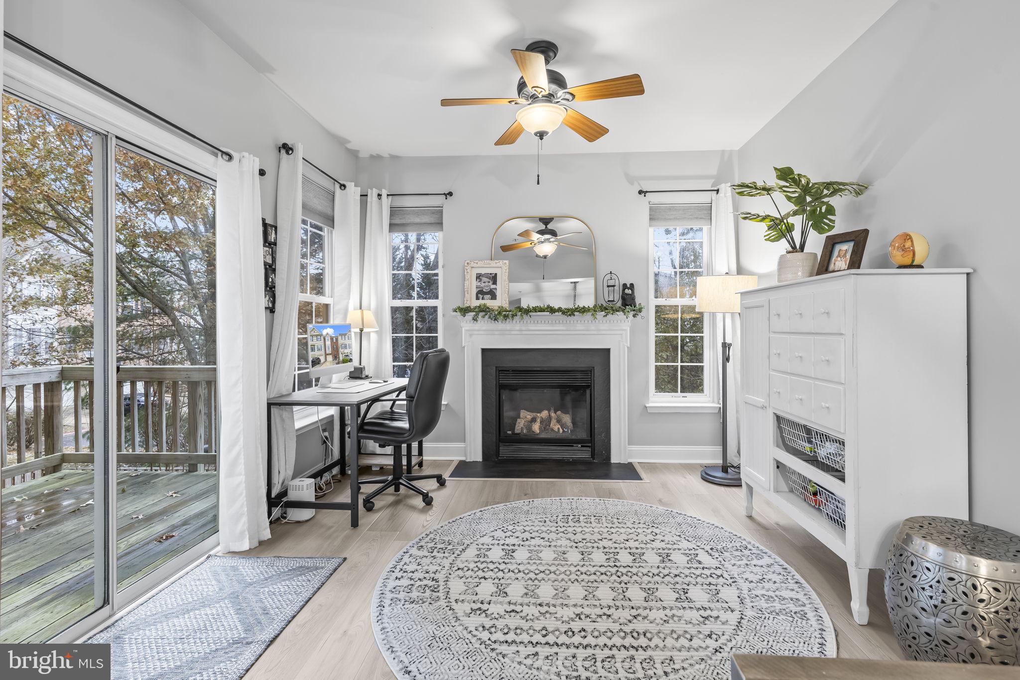 204 Braxton Way, Unit 204 Edgewater, MD 21037 - Photo 6 of 50 a living room with furniture and a fireplace