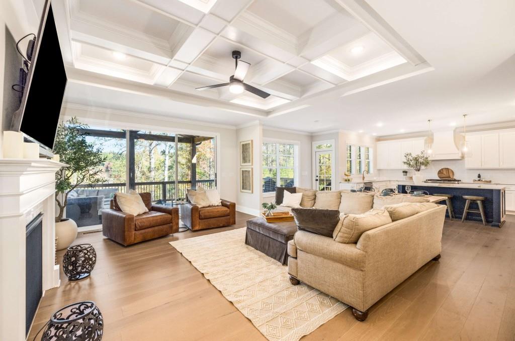 4045 Haven Terrace Milton, GA 30004 - Photo 2 of 46 a living room with furniture floor to ceiling window and a flat screen tv