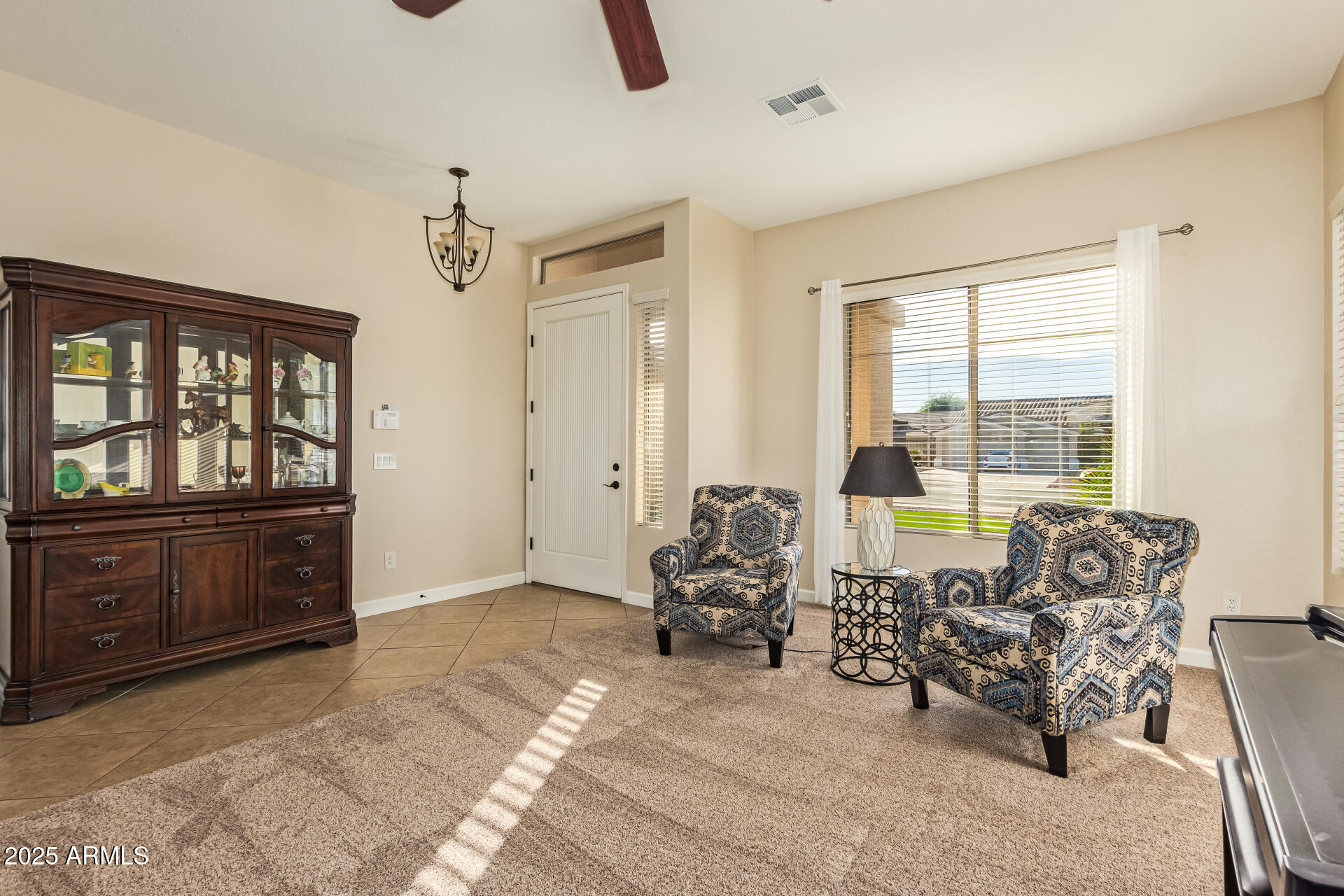 535 South Lemon Court Gilbert, AZ 85296 - Photo 11 of 36 a living room with furniture and a window
