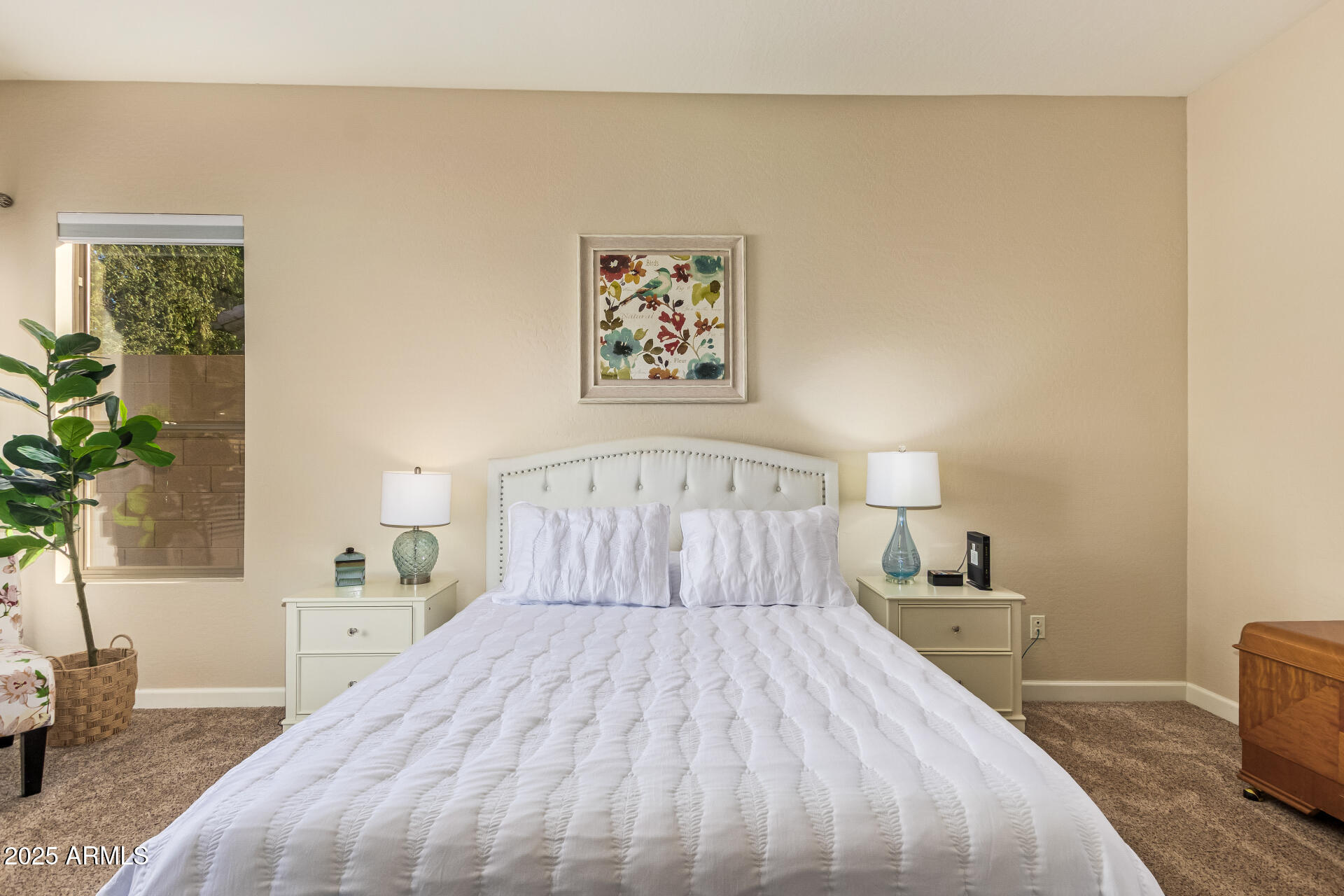 535 South Lemon Court Gilbert, AZ 85296 - Photo 14 of 36 a bedroom with a large bed and a potted plant