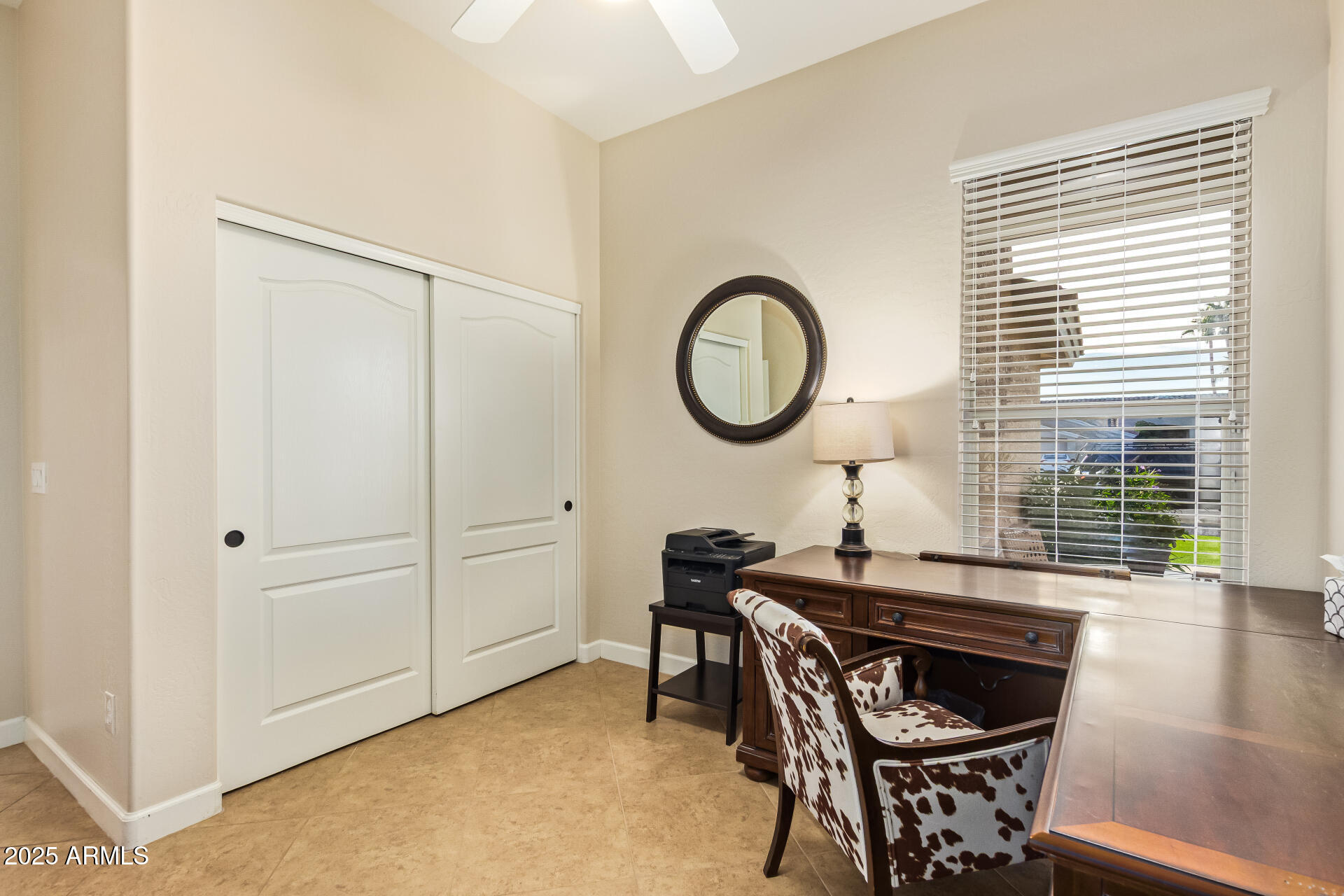 535 South Lemon Court Gilbert, AZ 85296 - Photo 21 of 36 a living room with a table chairs and a window