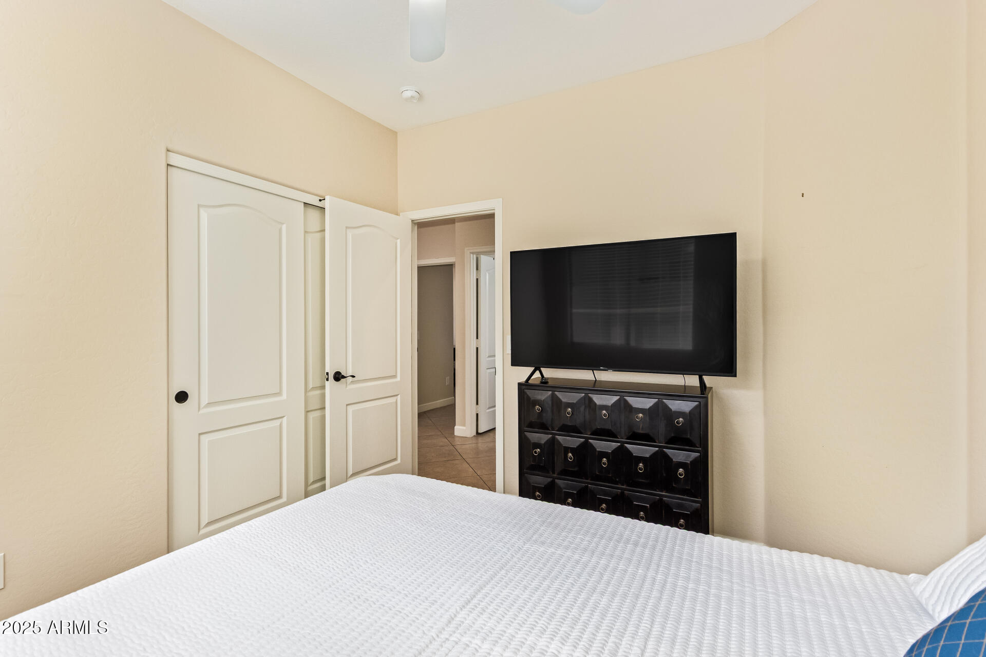 535 South Lemon Court Gilbert, AZ 85296 - Photo 23 of 36 a bedroom with a bed and a flat screen tv