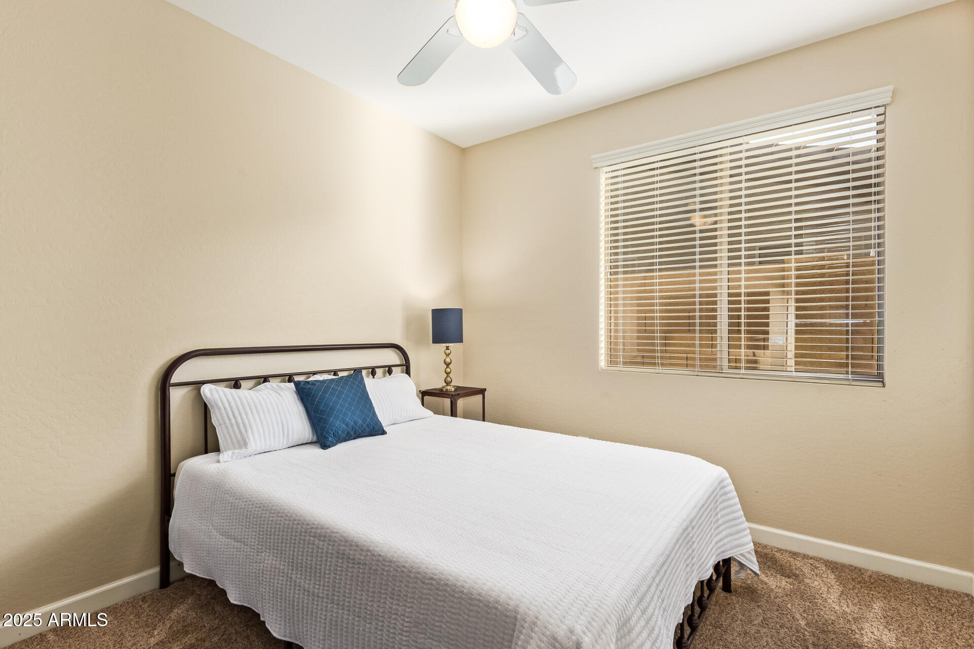 535 South Lemon Court Gilbert, AZ 85296 - Photo 24 of 36 a bedroom with a bed and window