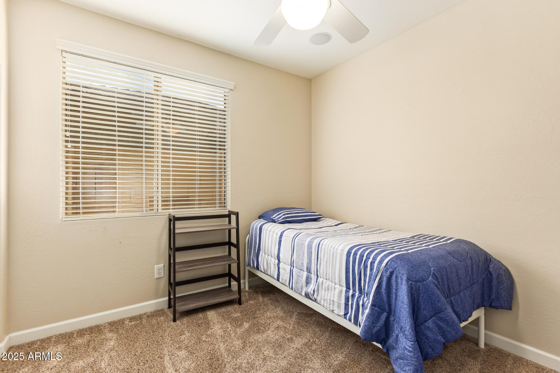535 South Lemon Court Gilbert, AZ 85296 - Photo 26 of 36 a bedroom with a bed and a window