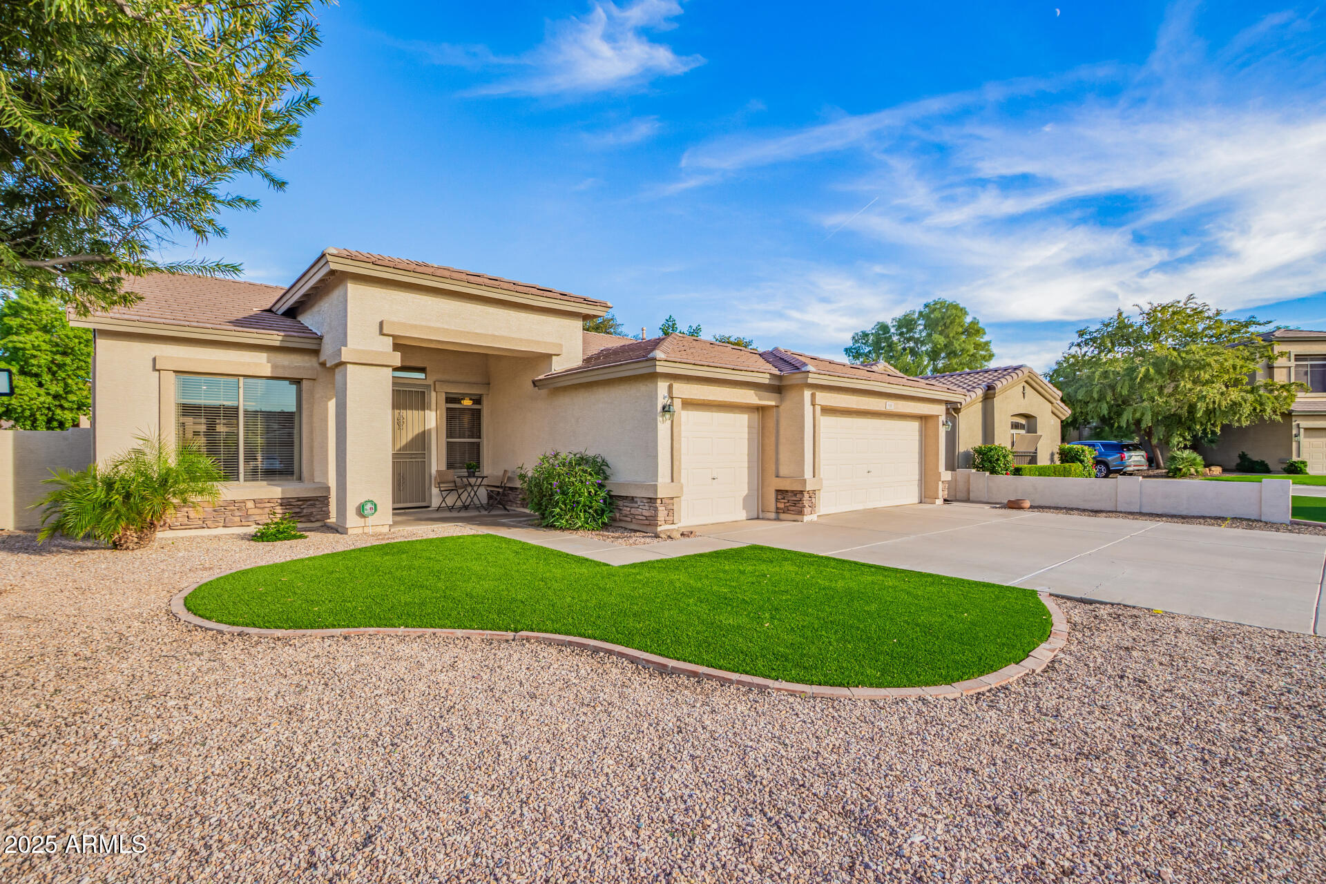535 South Lemon Court Gilbert, AZ 85296 - Photo 33 of 36 a view of a white house with a big yard plants and large trees