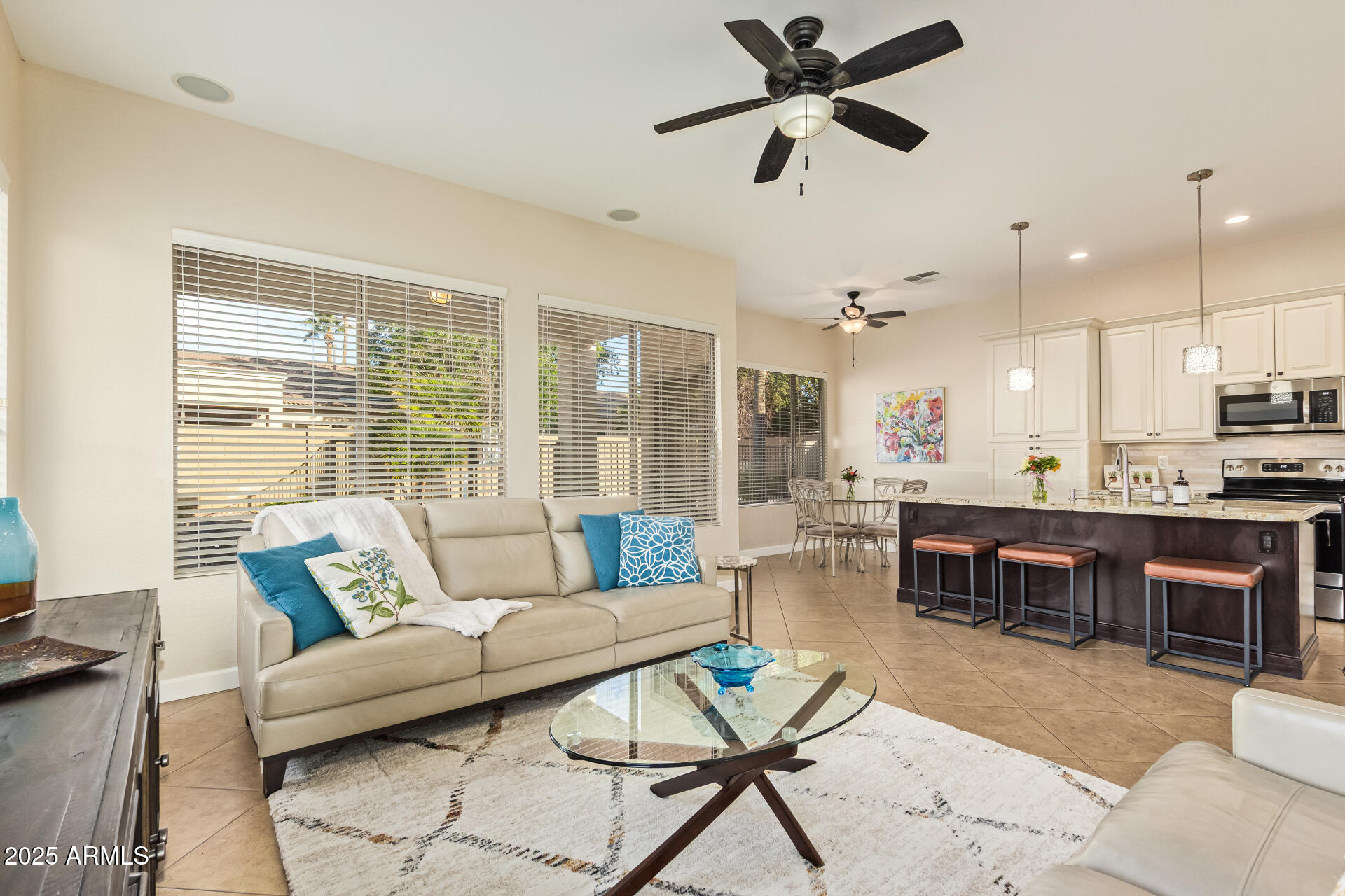 535 South Lemon Court Gilbert, AZ 85296 - Photo 5 of 36 a living room with furniture kitchen view and a large window