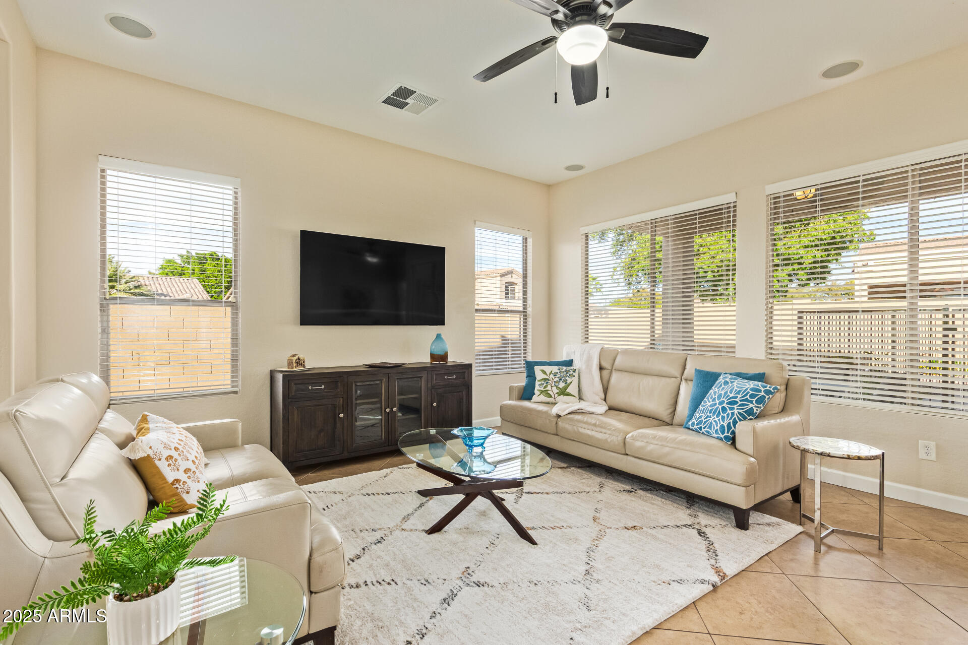 535 South Lemon Court Gilbert, AZ 85296 - Photo 6 of 36 a living room with furniture and a flat screen tv
