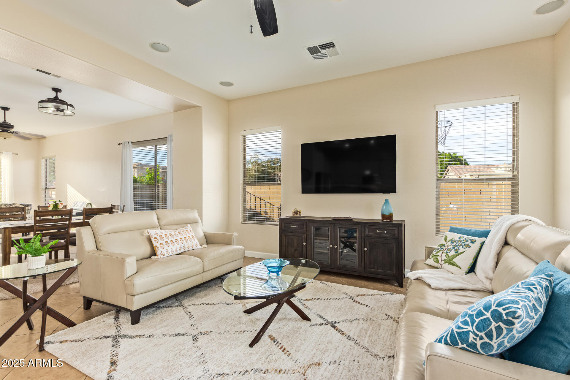 535 South Lemon Court Gilbert, AZ 85296 - Photo 7 of 36 a living room with furniture and a flat screen tv
