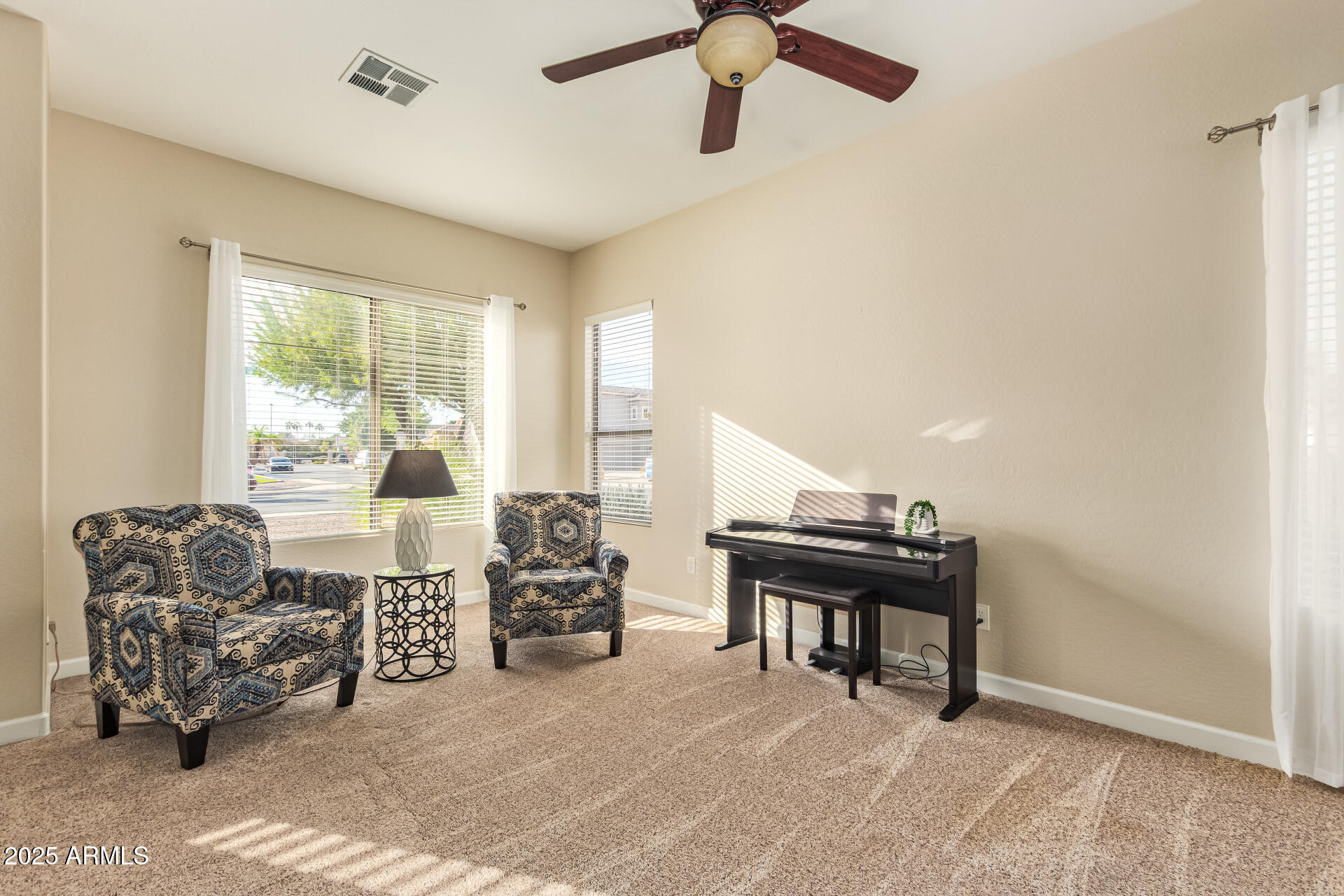 535 South Lemon Court Gilbert, AZ 85296 - Photo 10 of 36 a living room with furniture and a large window