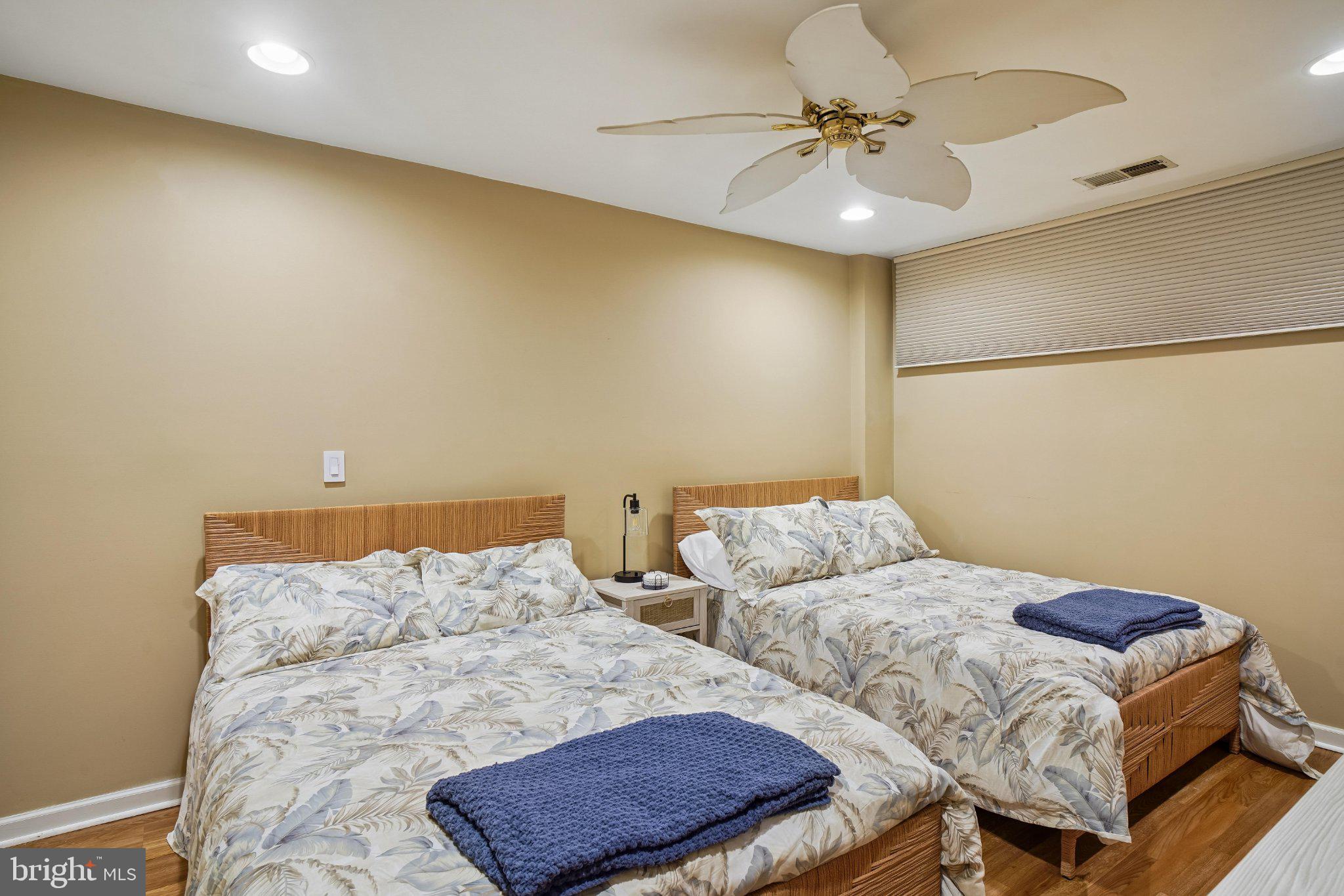 902 Chesapeake House Road, Unit 902N Bethany Beach, DE 19930 - Photo 15 of 37 Cozy twin bedroom with serene decor.