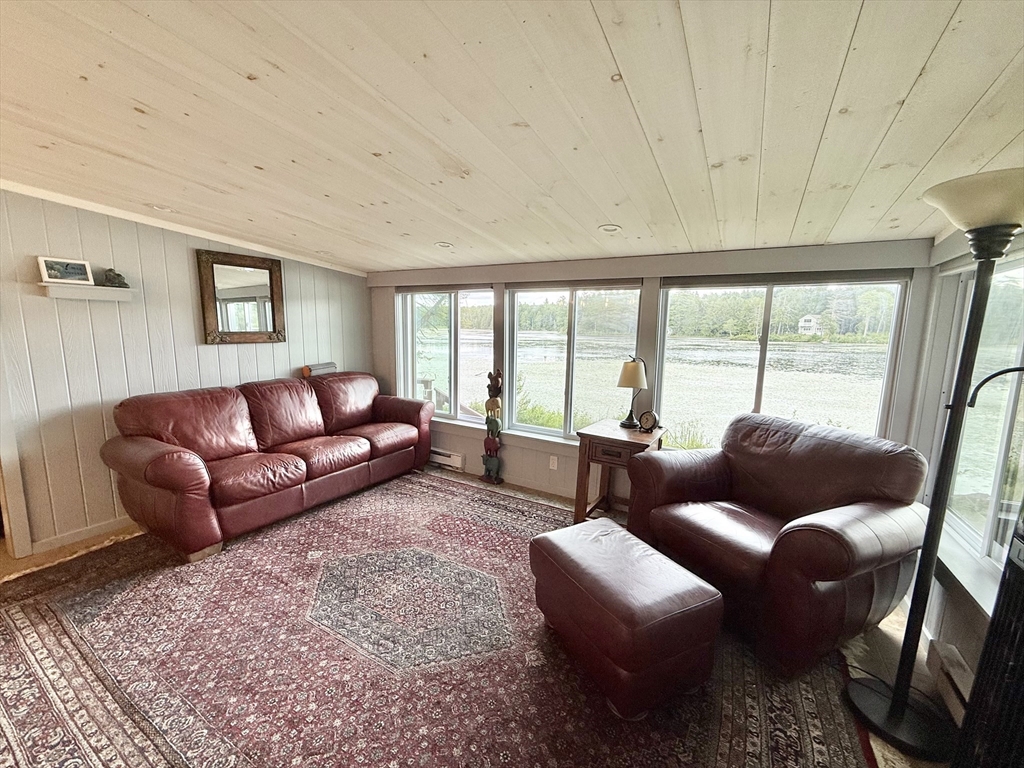 46 Bray Road Chesterfield, MA 01012 - Photo 6 of 12 a living room with furniture and a floor to ceiling window