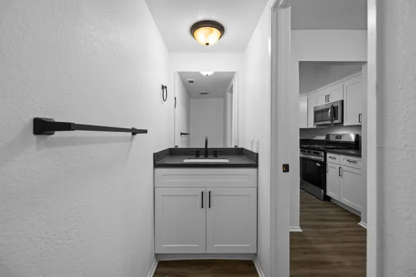 a bathroom with a sink and a mirror