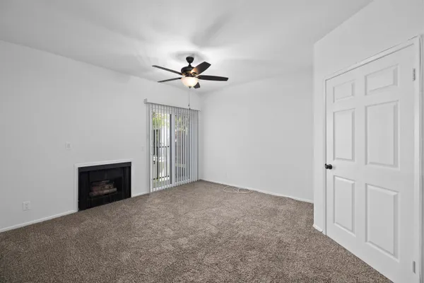 a view of an empty room with a bathroom