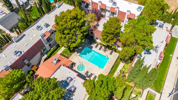 an aerial view of a house with a yard and garden