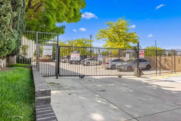 a view of a wrought iron fences in front of house