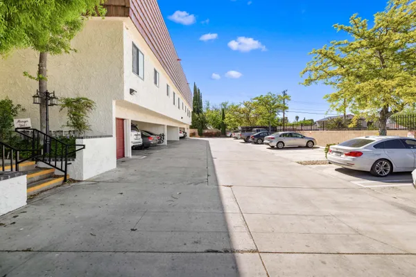 a view of a cars park in front of a house