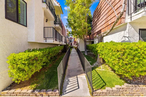 a view of a pathway with house on both side