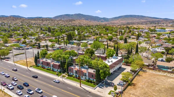 an aerial view of residential houses and outdoor space